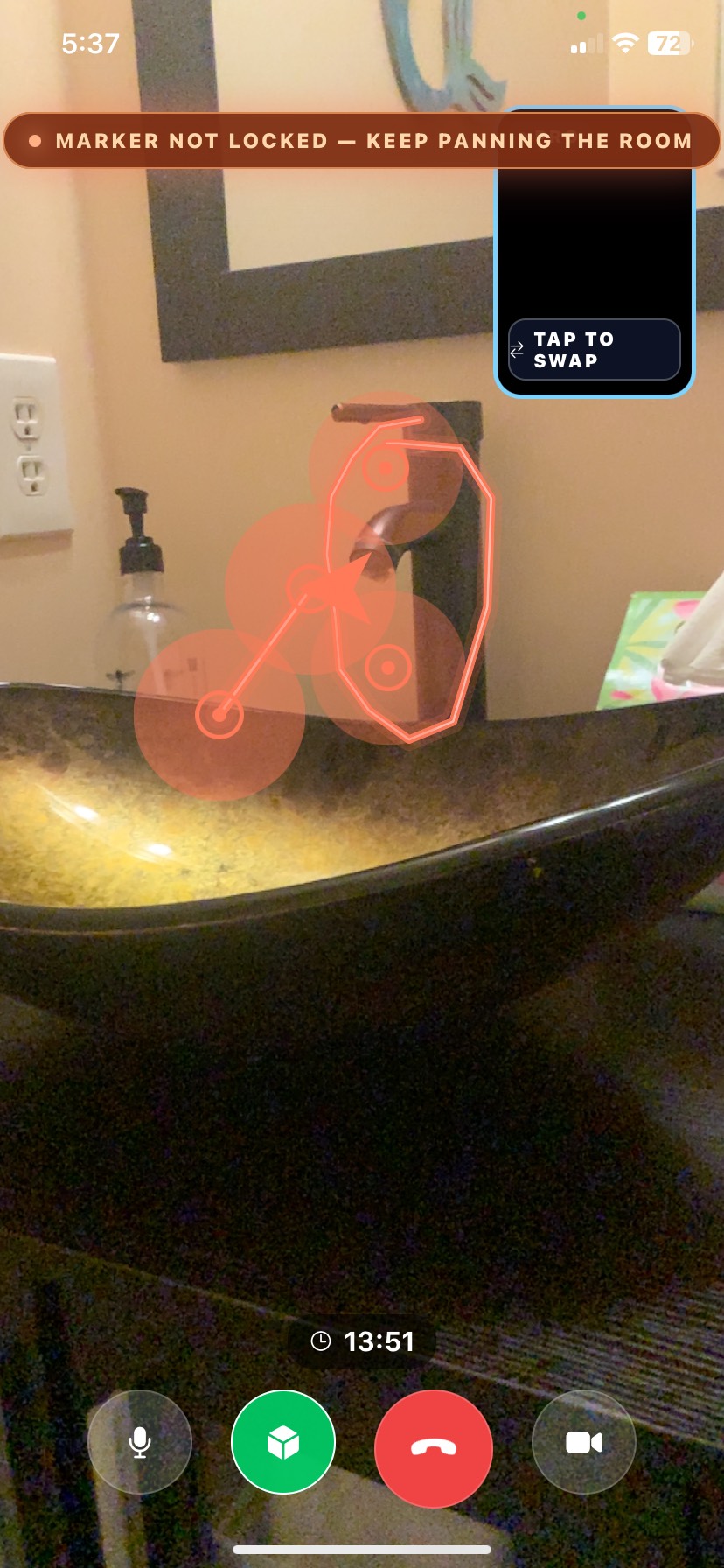 Live KanDu expert call: the expert has circled the faucet cartridge and drawn arrows on the caller camera view